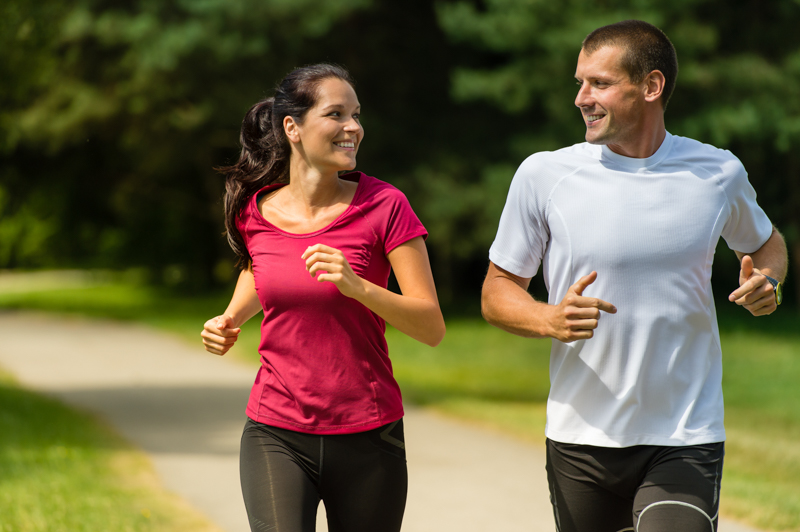 Happy couple exercising (running) together
